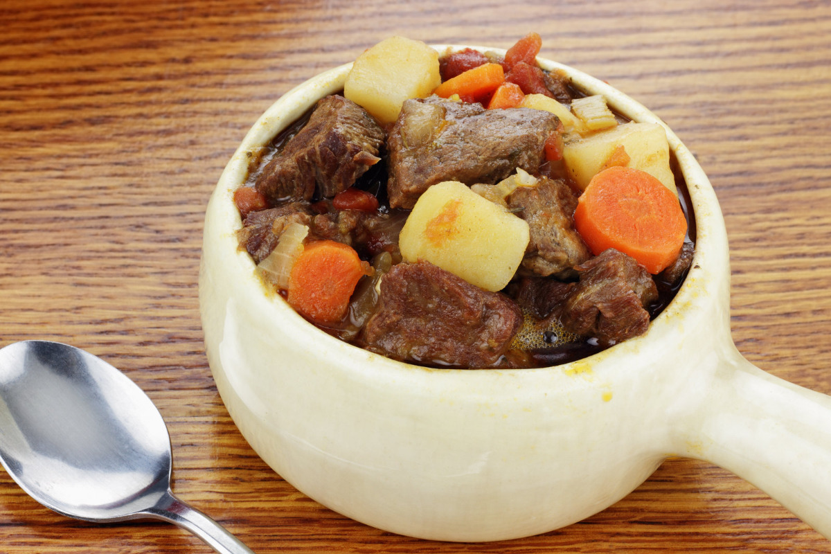 Beef stew made with vegetables in bowl.