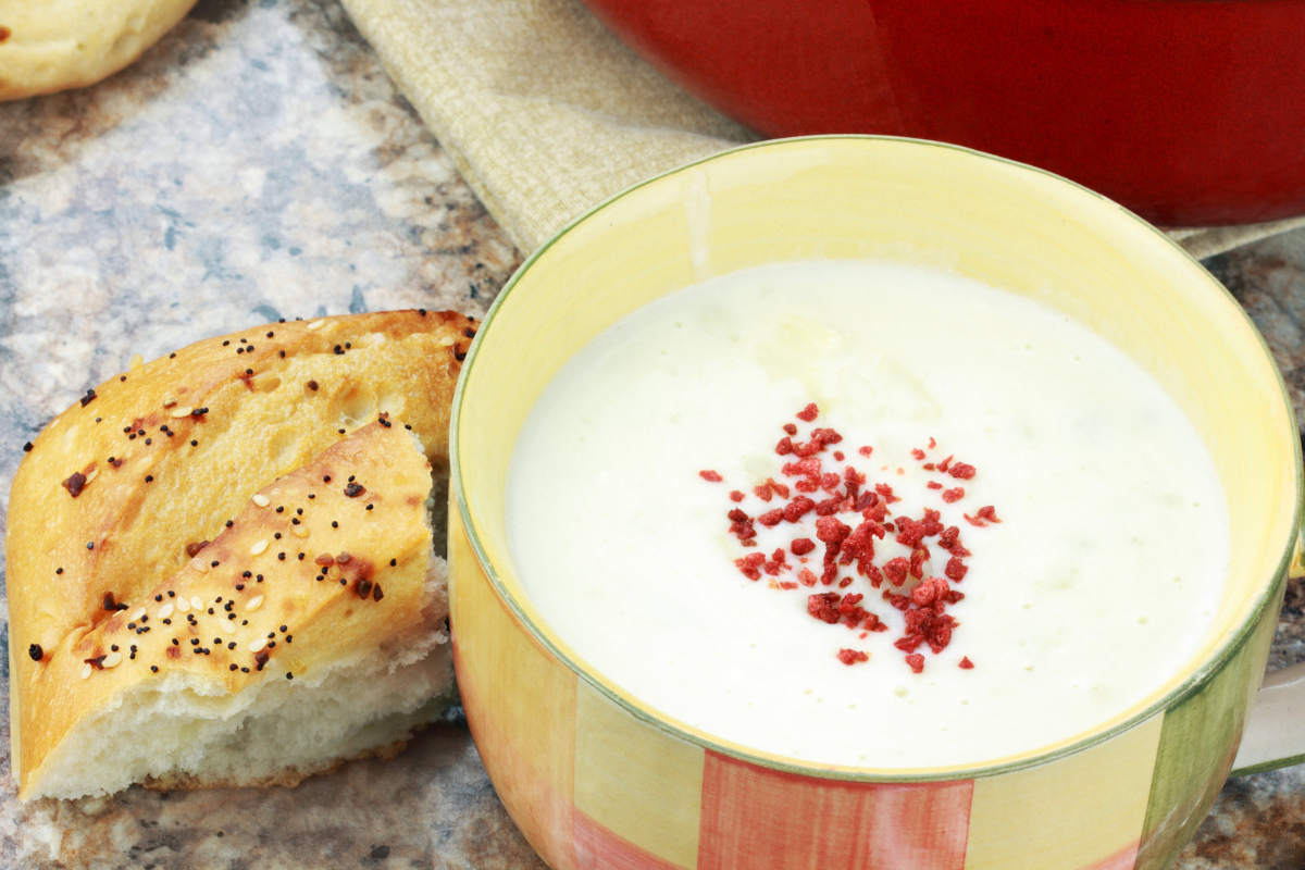 Potato soup with a side of bread.
