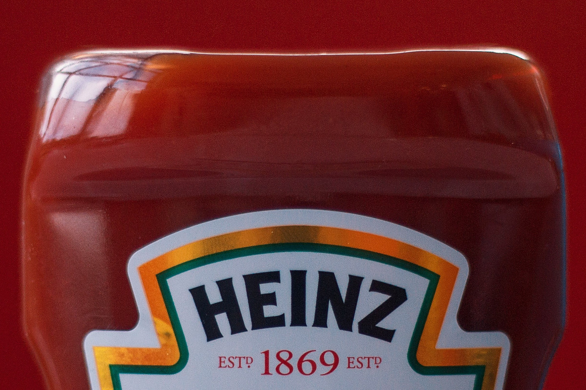 The Heinz logo on a bottle of their ketchup.