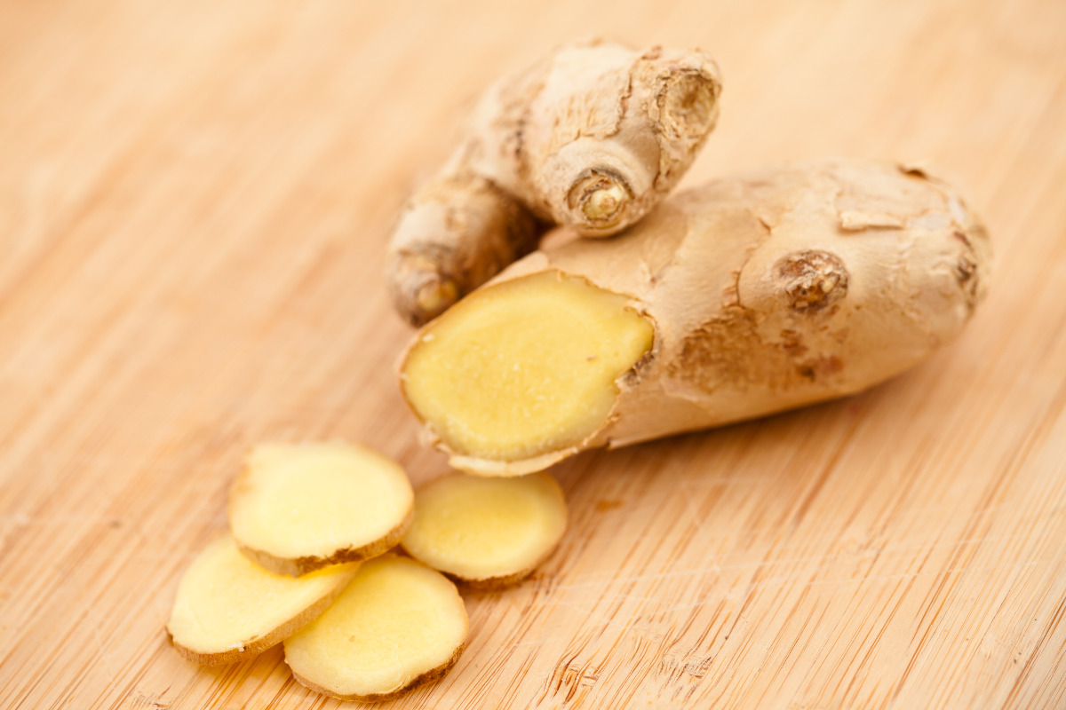 Freshly cut ginger on a cutting board.